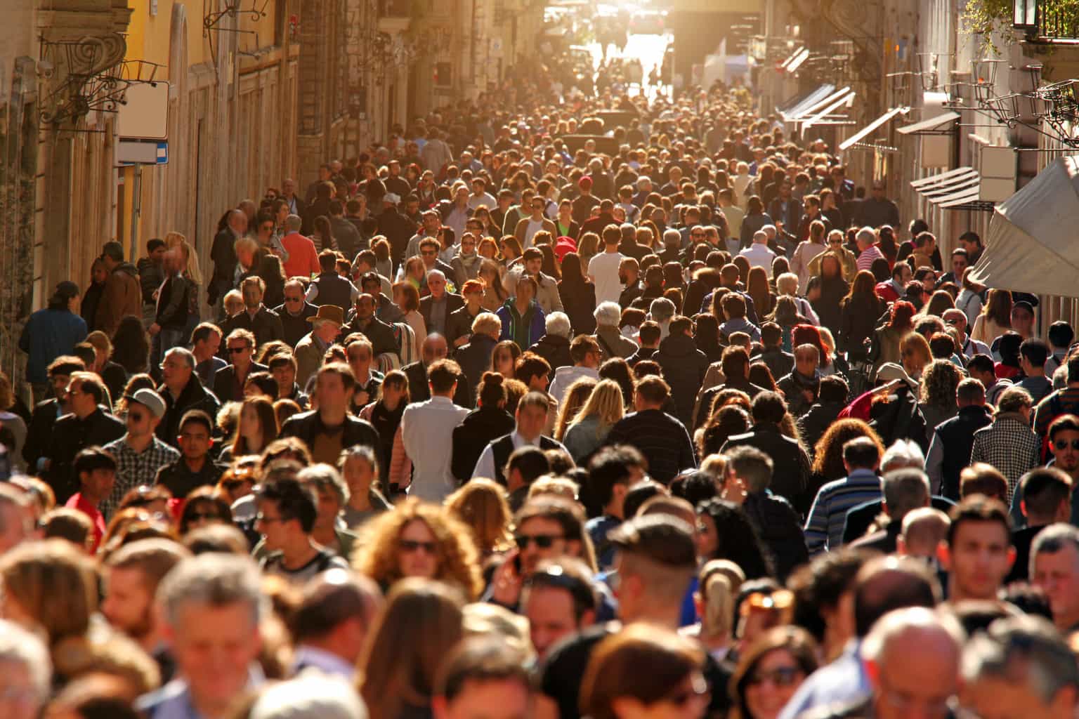 crowd-of-people-walking-on-street-in-downtown-rome-sunlight-our